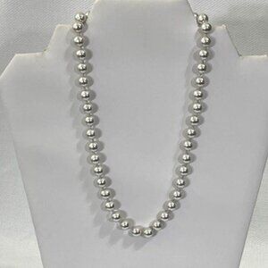 Monet Pearl-like necklace with silver tones.